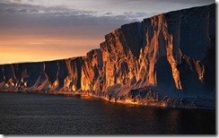 Adelie Sea, cliffs in sunset, Antarctica