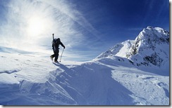 Skier hiking to summit