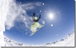 Young man snowboarding