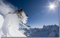 Skier in a puff of snow, near Chamonix-Mont-Blanc, France