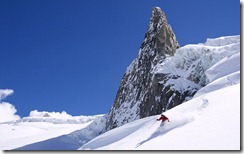 Skier off piste in deep powder