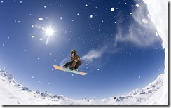 Young man snowboarding